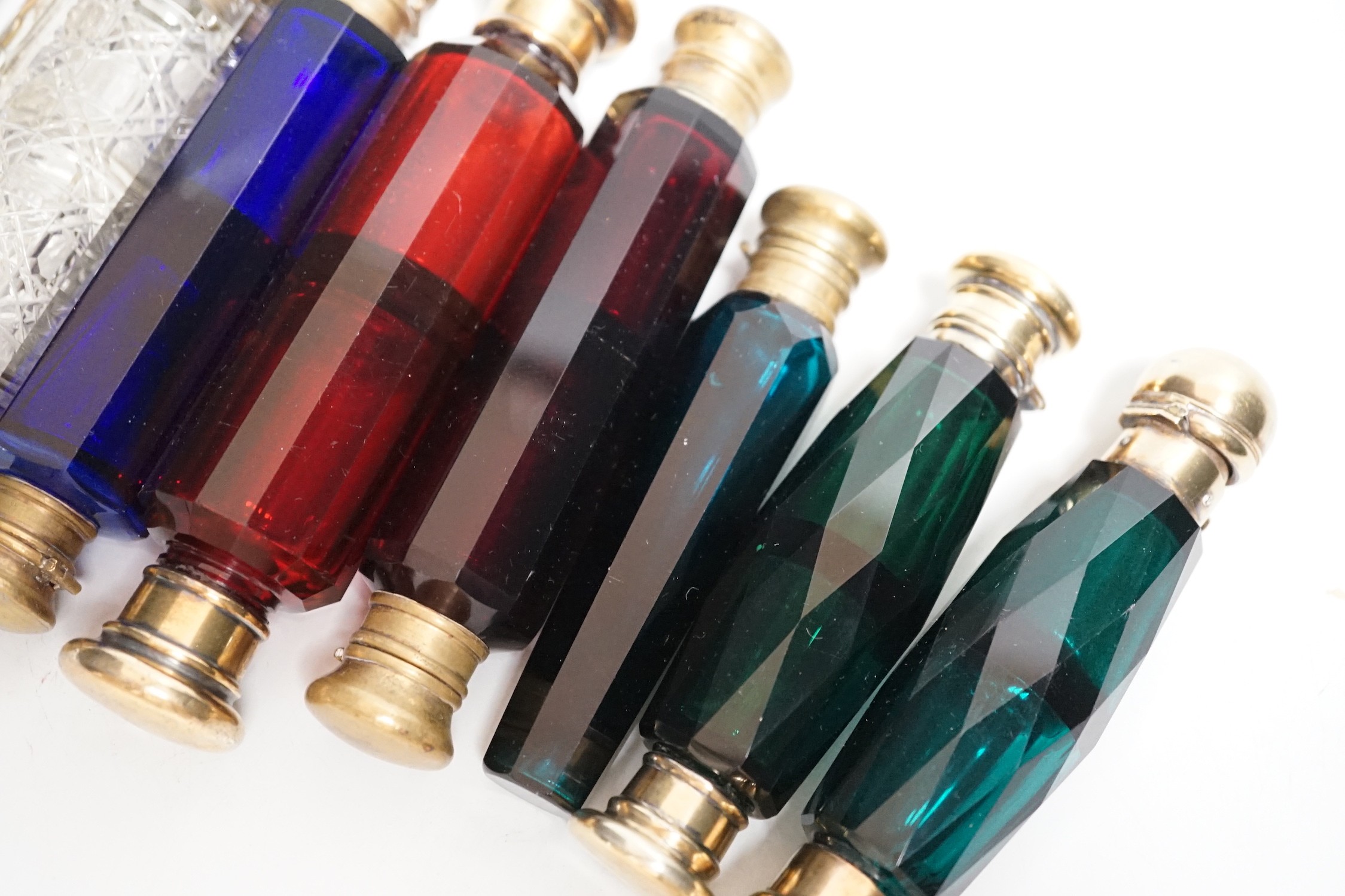 Seven 19th century coloured glass double ended scent bottles and three others